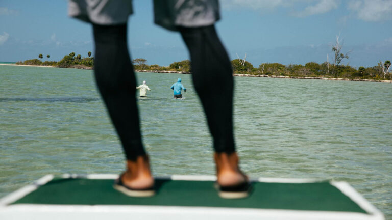 Artistic photo of two people inshore fly fishing in Ascension Bay, Mexico.