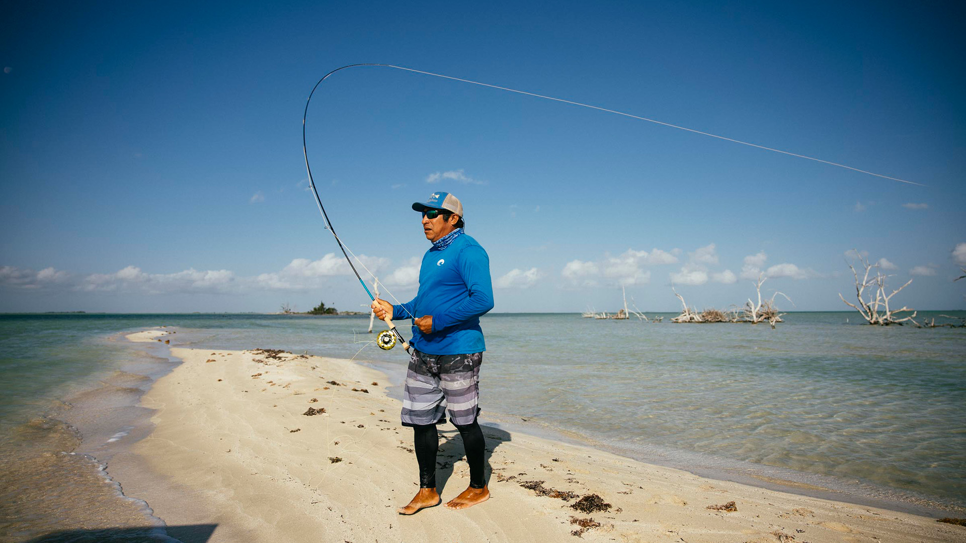 Inshore fly fishermen casts his rod in Ascension Bay, Mexico.